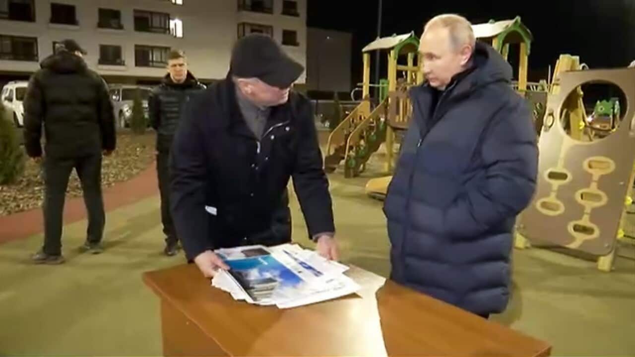Russian President Vladimir Putin (R) and Deputy Prime Minister Marat Khusnullin visit Mariupol in Russian-controlled Donetsk region, Ukraine