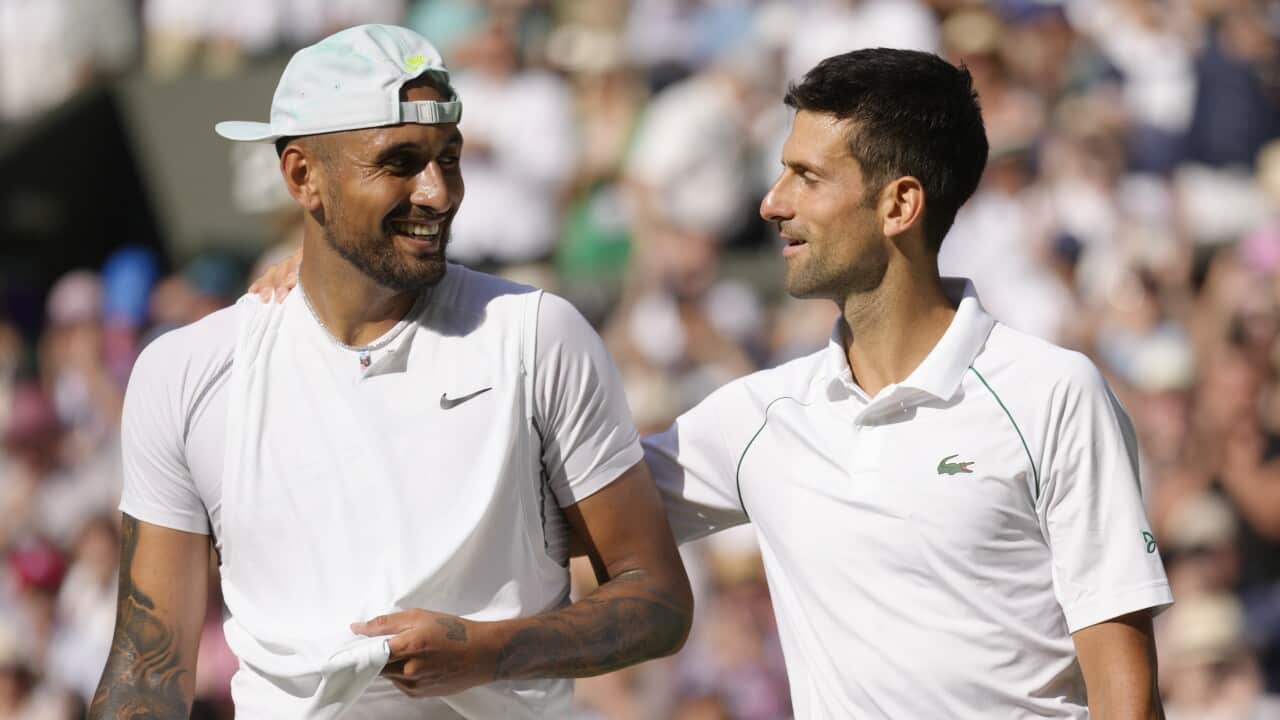 Serbia's Novak Djokovic hugs Australia's Nick Kyrgios after beating him in the Wimbledon final 2022