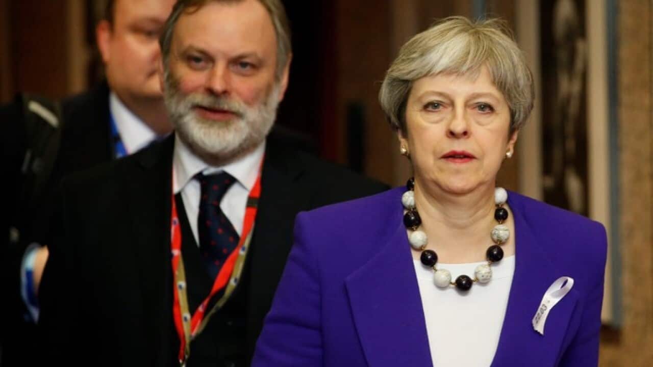 Theresa May leaving the European Council meeting
