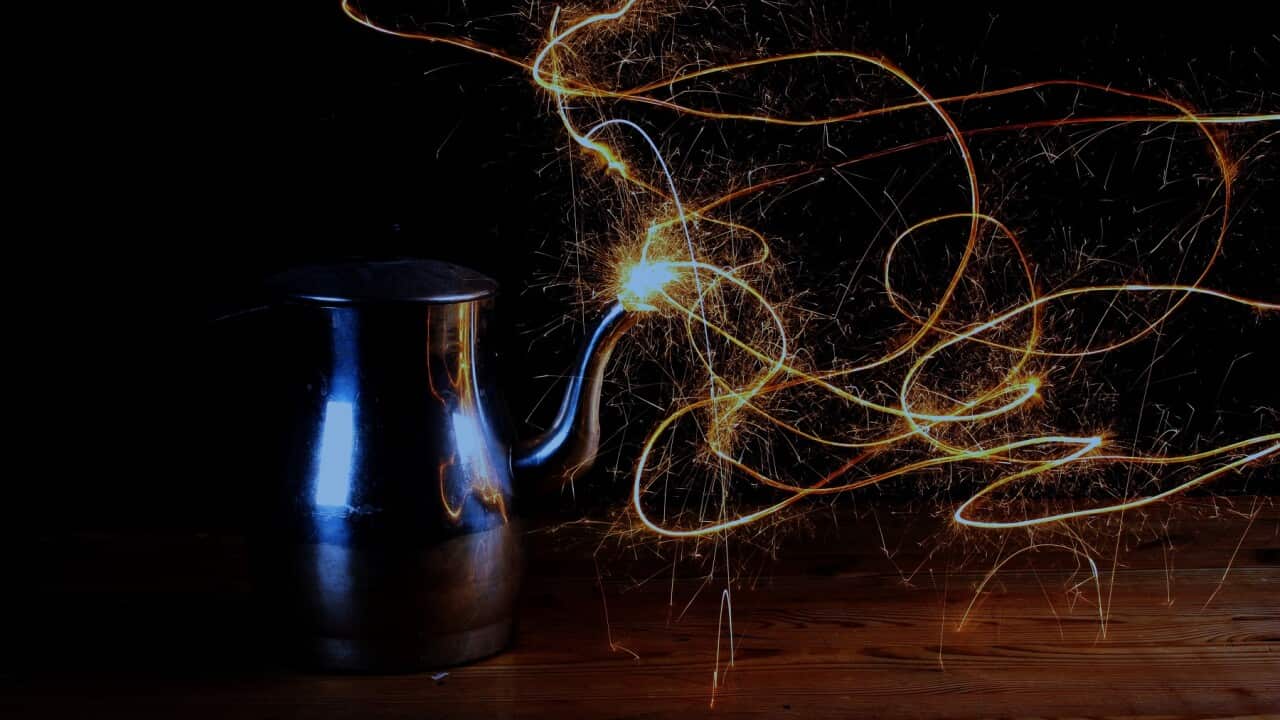 Close-Up Of Genie Coming Out Of Bottle