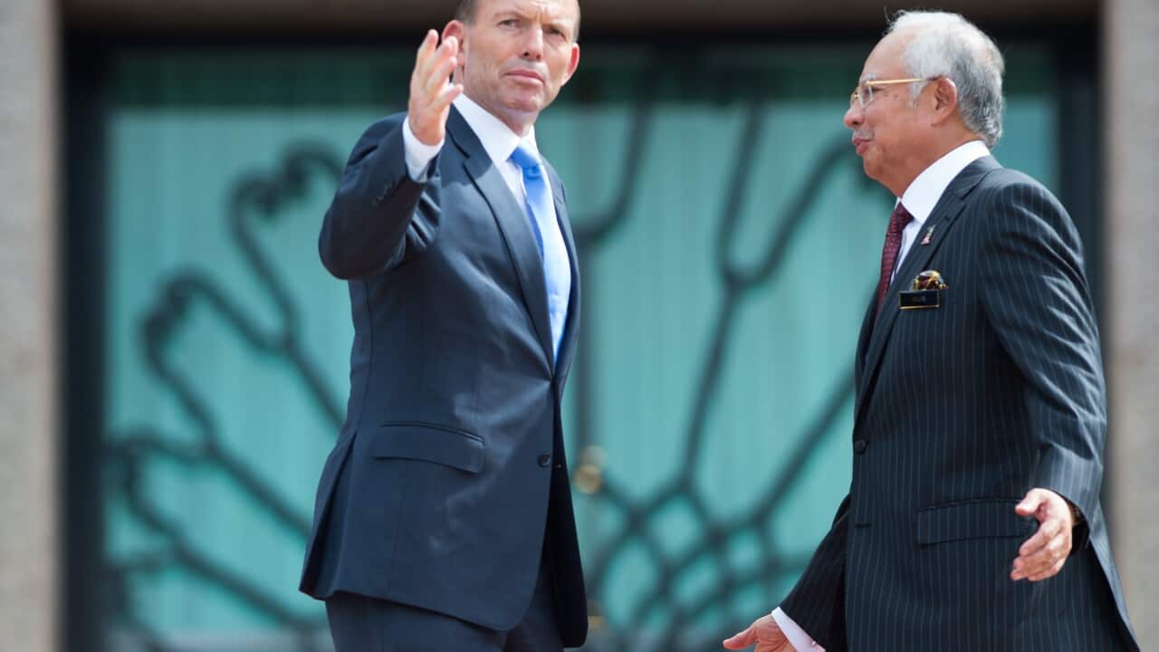 Malaysia's Prime Minister Najib Razak welcomes Prime Minister Tony Abbott