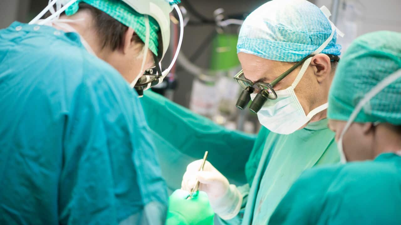 Heart surgeons during a heart operation