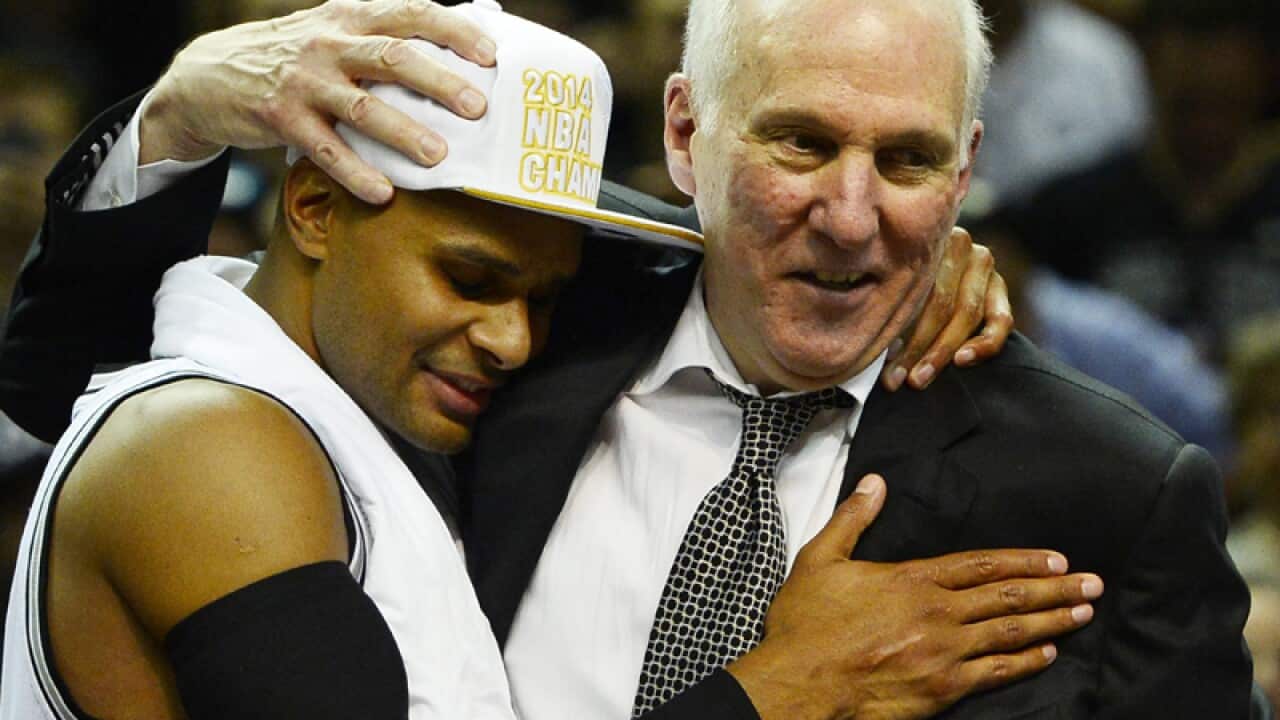 Patty Mills and Coach Greg Popovich.