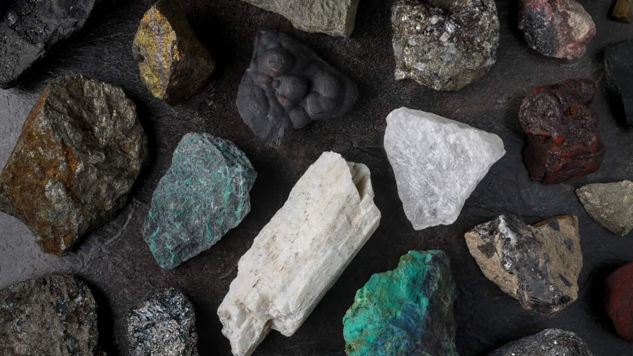 Mixture of critical minerals (United States of America definition), or critical raw materials (European Union definition). Flatlay on slate background