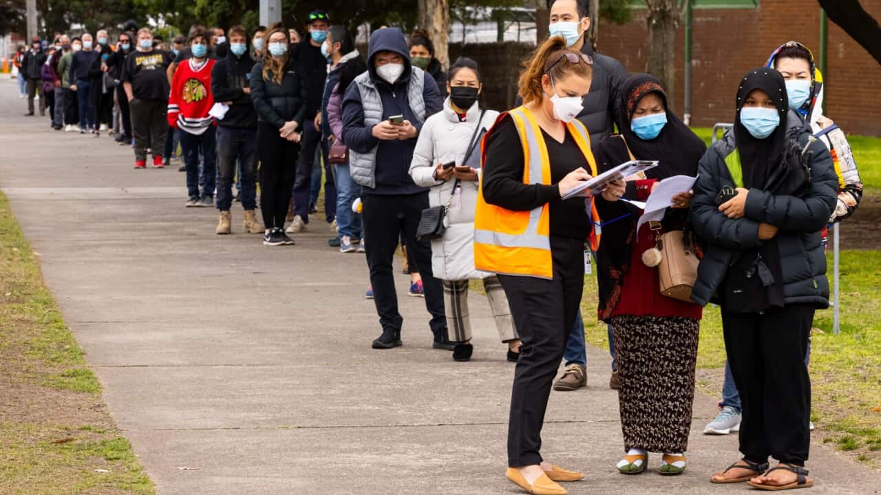 People line up for COVID vaccines at the Sandown Racecourse Vaccination Centre in Melbourne, Tuesday, August 31, 2021. Victoria will remain in lockdown after recording the highest number of new daily local COVID-19 cases in the state in almost a year.