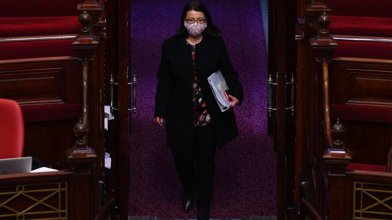 Victorian Health Minister Jenny Mikakos walks through Legislative Council at the Victorian State Parliament.