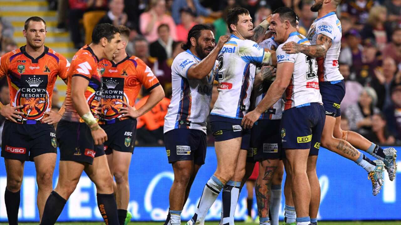 Titans players celebrate after Chris McQueen score a try