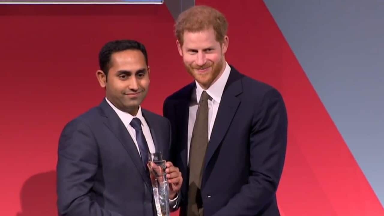 Australia's Usman Iftikhar receiving the award from Prince Harry.