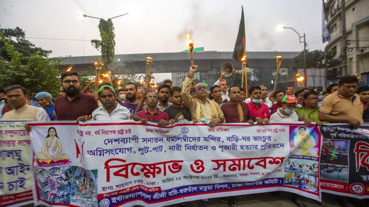 Bangladeshi Hindu community members join torch procession blocking Shahabagh road during a protest against communal attackBangladesh, 22 October 2021.