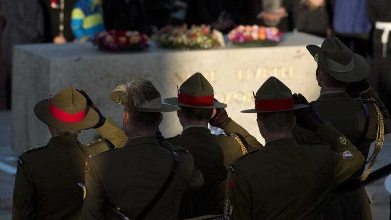 Defence Force personnel at a ceremony to mark the 50th anniversary of the Battle of Long Tan at the Australian War Memorial in Canberra, Thursday, Aug. 18, 2016