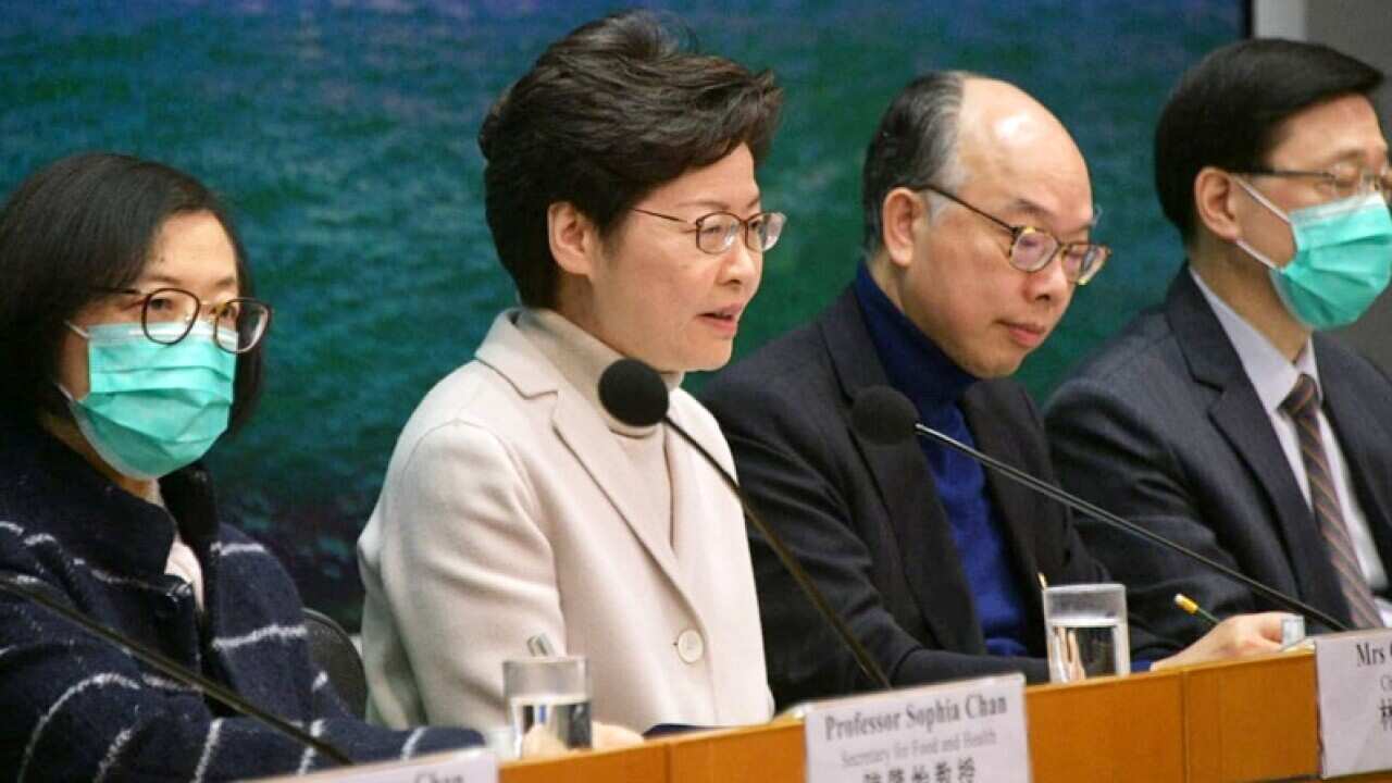 City’s chief executive bars civil servants from wearing the surgical masks, providing only three exemptions.