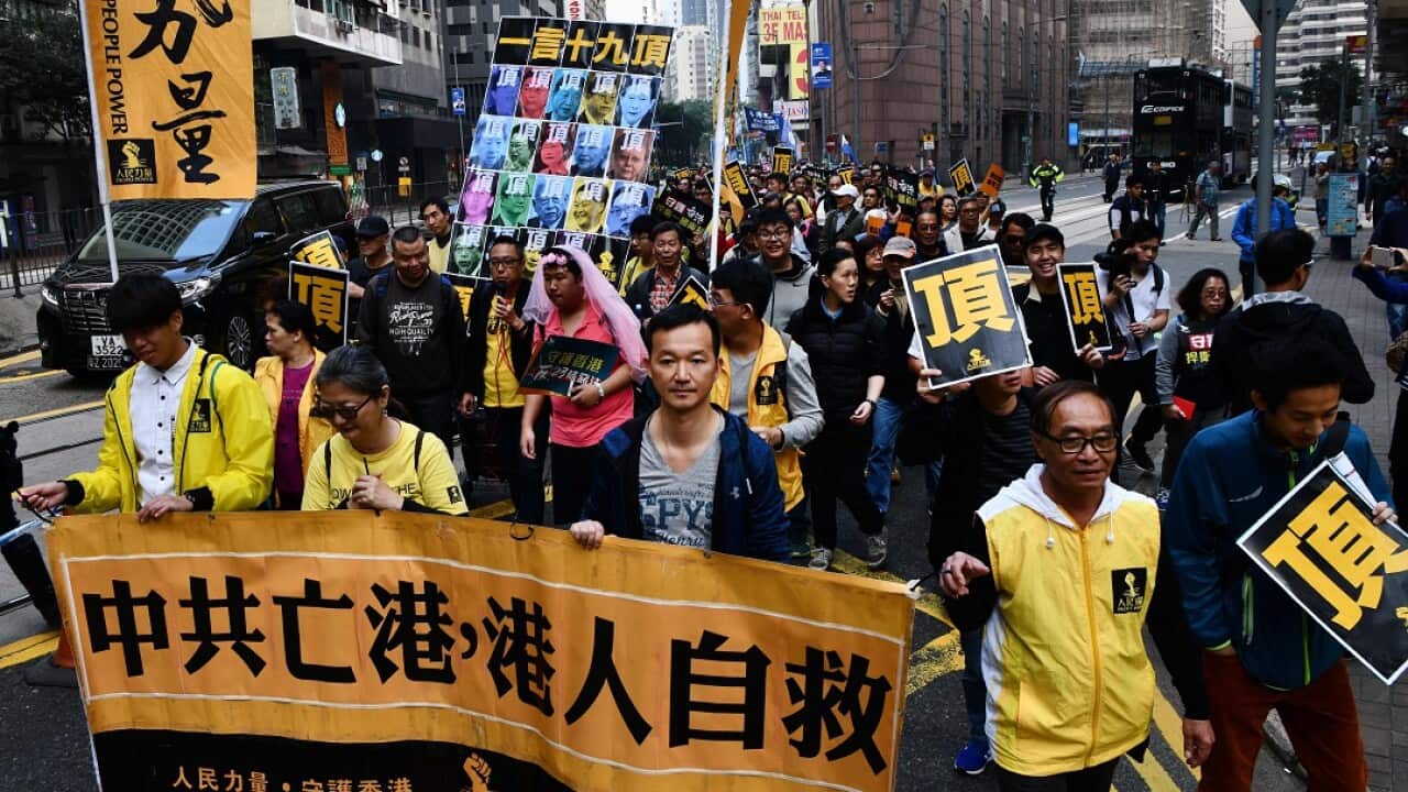Thousands take part in the annual New Year's Day pro-democracy rally in Hong Kong.
