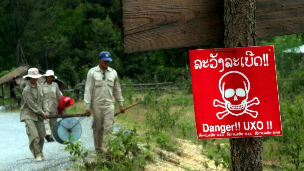 A Lao UXO at work (AAP Image - EPA - BARBARA WALTON)