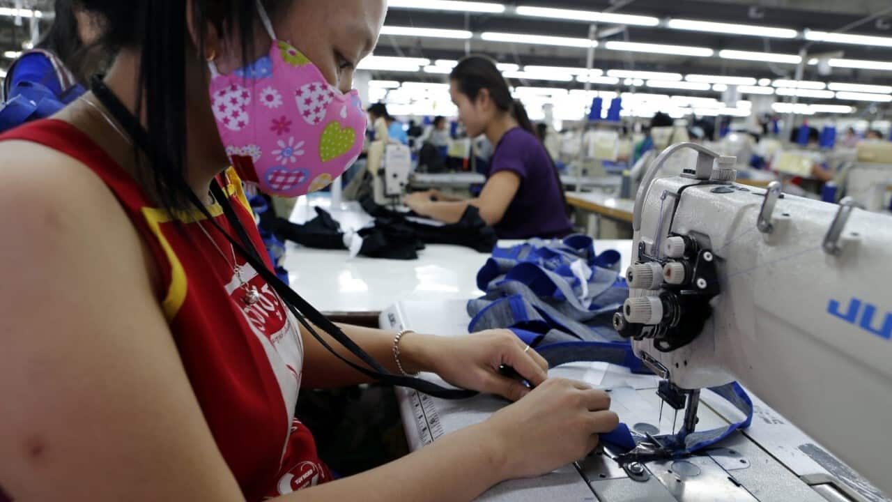 Laotian textile factory workers at work sewing (AAP Image-EPA-BARBARA WALTON)
