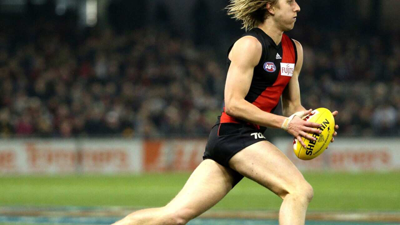 Dyson Heppell runs with the ball.