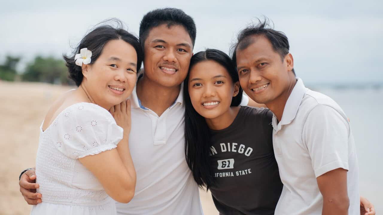 Lenny and her husband Henry with their children Peter and Eva Susanto (centre).Credit_ Supplied_Lenny.jpg