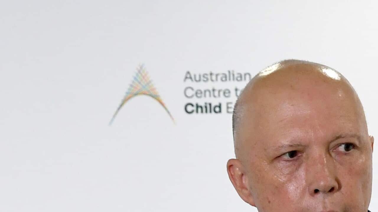 Australia's Minister for Home Affairs, Peter Dutton is seen during a visit to the Australian Centre to Counter Child Exploitation in Brisbane