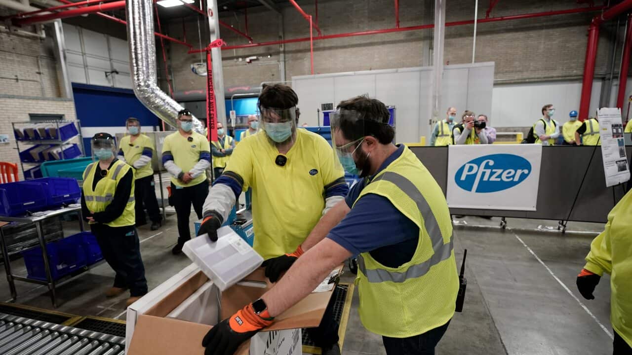Boxes containing the Pfizer-BioNTech COVID-19 vaccine are prepared to be shipped at the Pfizer Global Supply Kalamazoo manufacturing plant in Michigan.