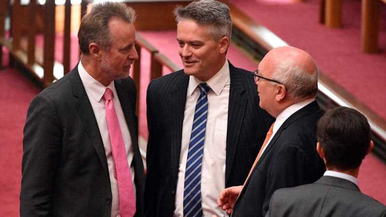Indigenous Affairs Nigel Scullion Minister, Finance Mathias Minister Cormann and Attorney-General George Brandis during a debate on company tax cuts.