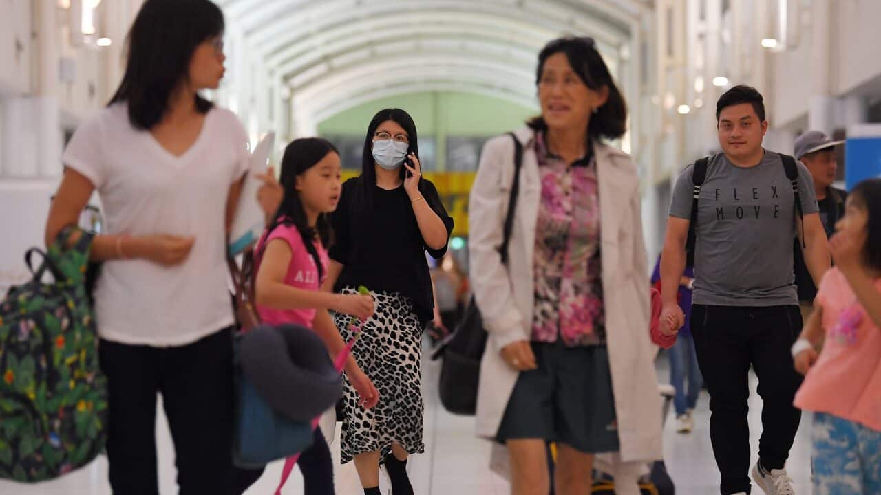 Australian evacuees who were quarantined on Christmas Island over concerns about the COVID-19 coronavirus arrive at Sydney Airport in Sydney.
