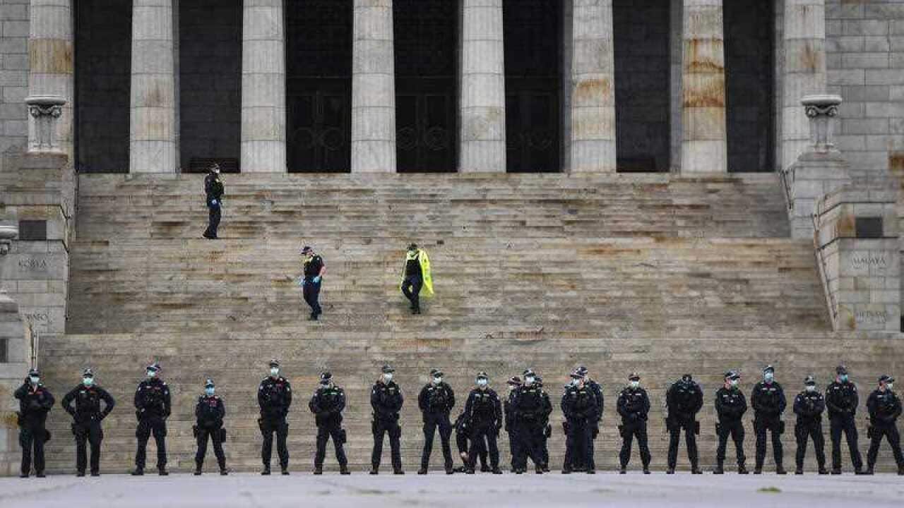 Police are seen at the Shrine of Remembrance before a planned anti-lockdown protest in Melbourne, Saturday 12 September. 