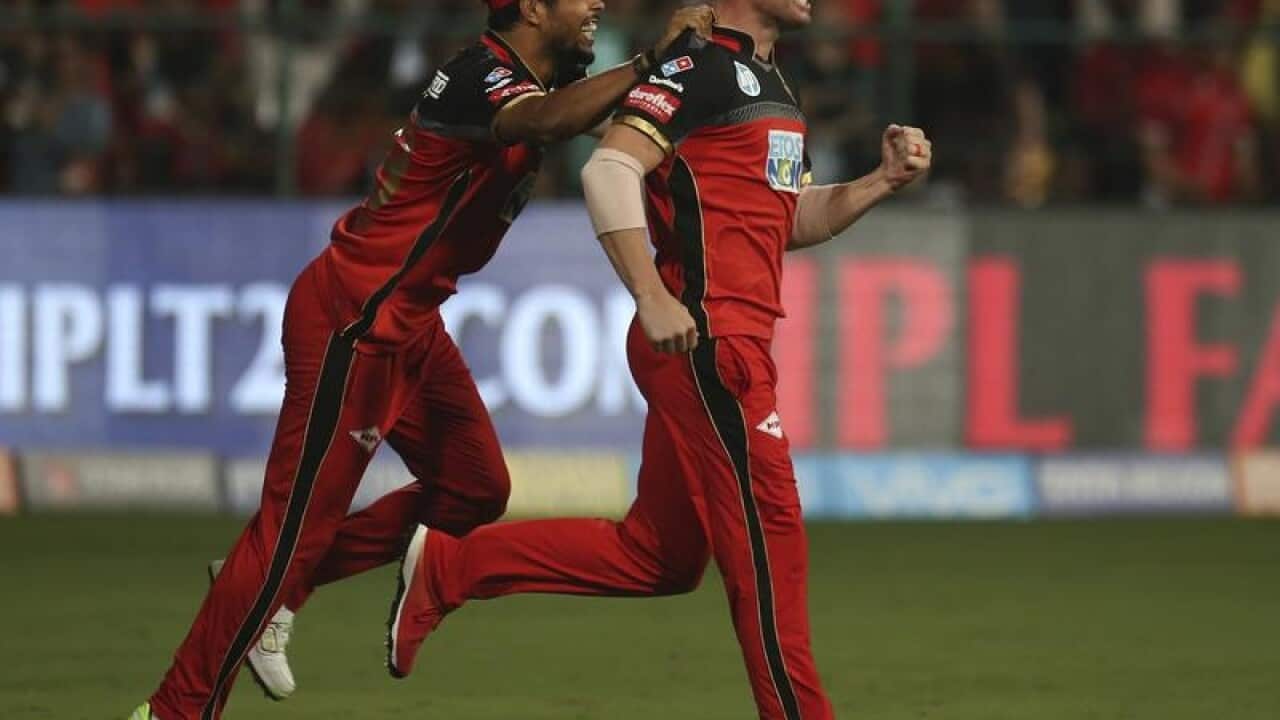 AB de Villiers (R) celebrates after taking a catch in the IPL