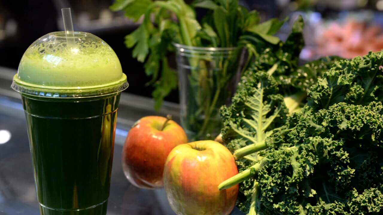 Fresh fruit and vegetables in a juice