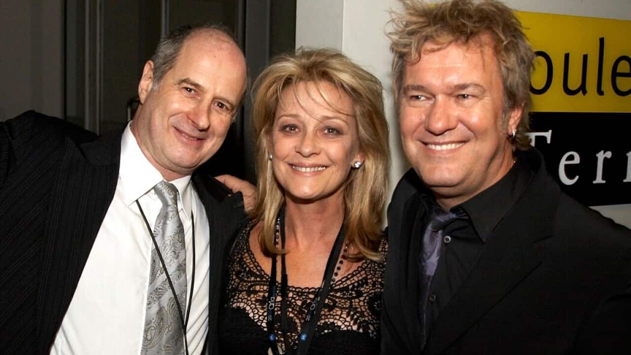 Michael Gudinski (left), his wife Sue (centre) and rocker Jimmy Barnes attend the Bacardi ARIA Aftershow Party in Sydney on Sunday, Oct. 29, 2006. (Photo by AAP Image/Bacardi)