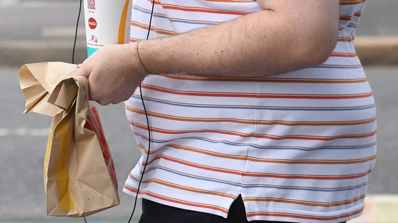 A man carries fast food