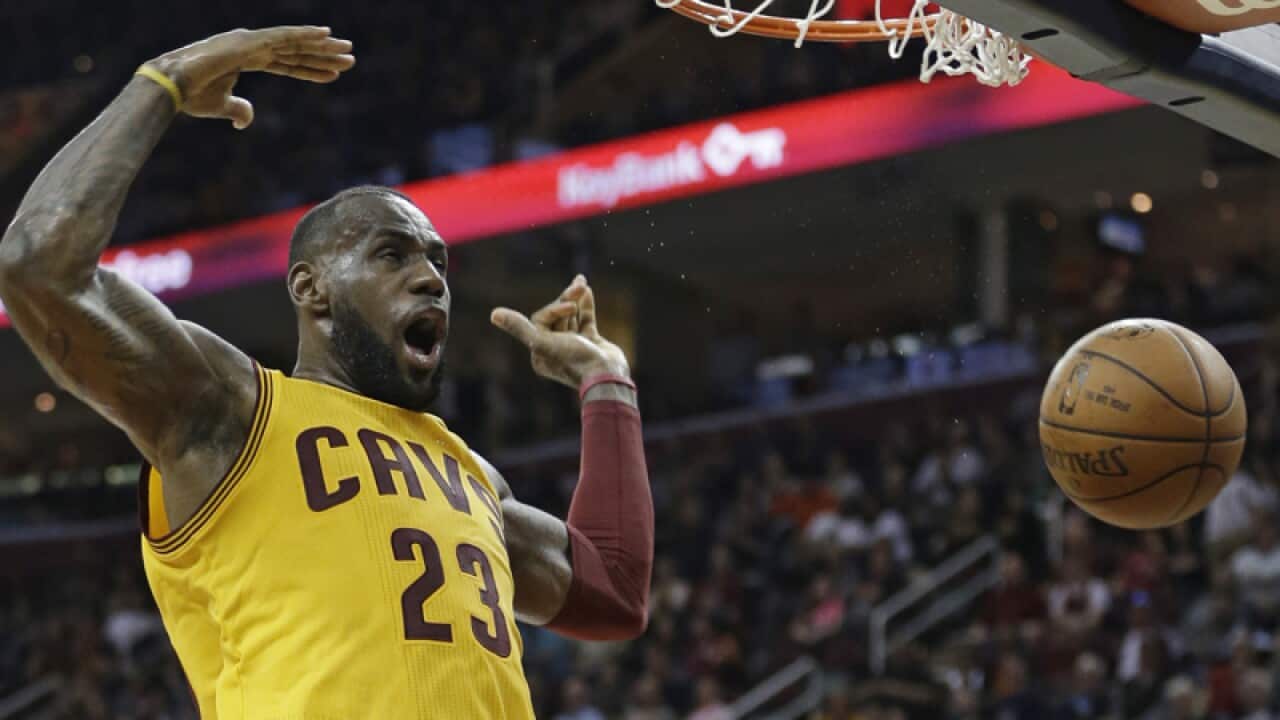 Cleveland Cavaliers' LeBron James scores against the Brooklyn Nets