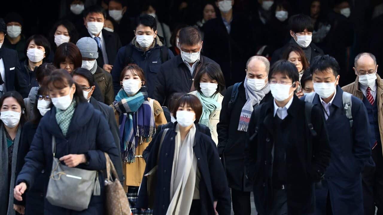 Commuters in Tokyo on Tuesday.