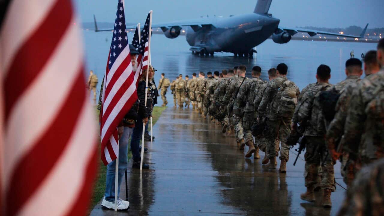 Paratroopers from the 82nd Airborne Division prepare equipment and load aircraft bound for Fort Bragg, ahead of deployment to Iraq.