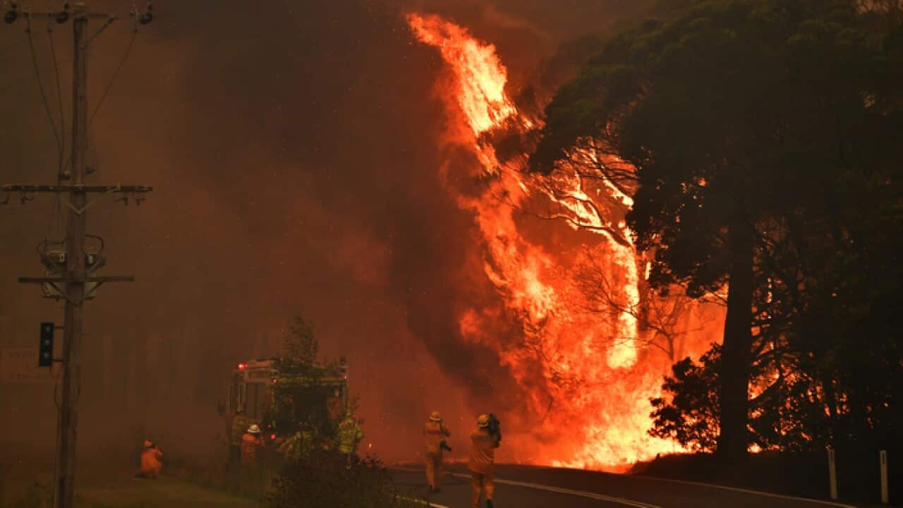 A fire truck is seen during a bushfire near Bilpin, 90km north west of Sydney, Thursday, December 19, 2019. (AAP Image/Mick Tsikas) NO ARCHIVING