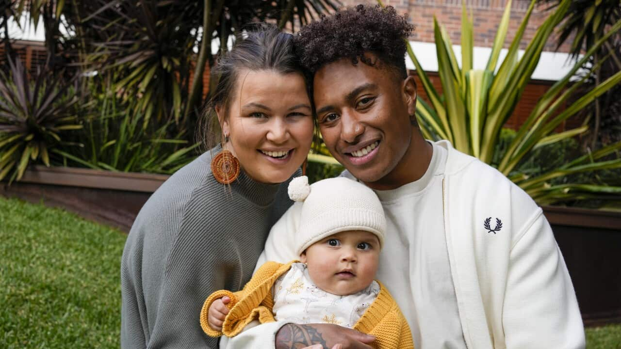 Olympics Gold Medalist Ellia Green (right) and wife Vanessa Turnbull-Roberts holding their baby daughter Waitui.