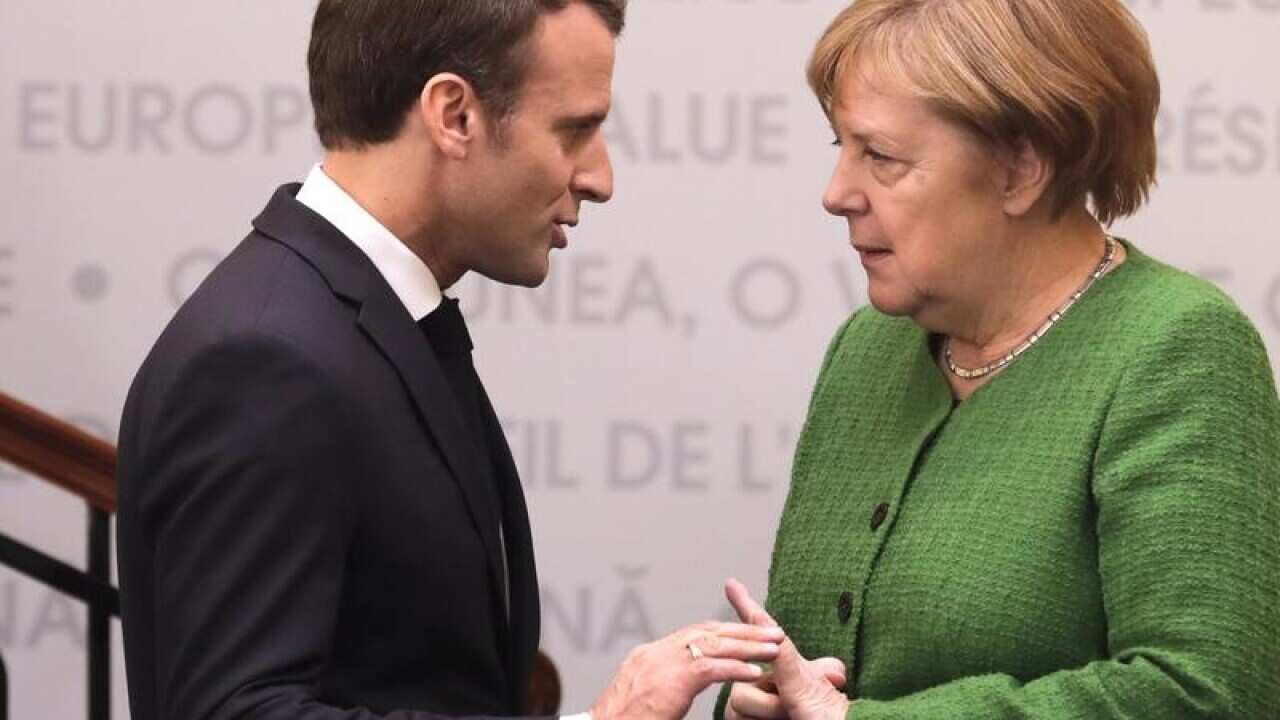 German Chancellor Angela Merkel with French President Emmanuel Macron.
