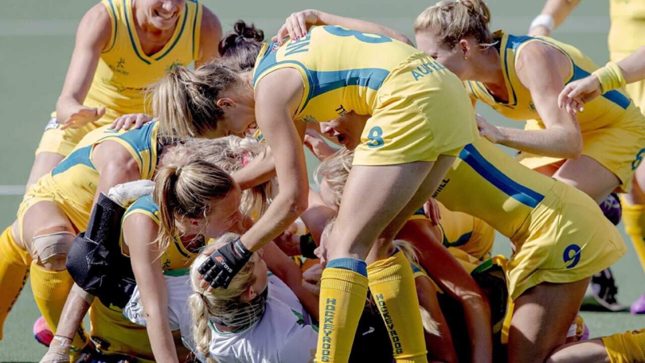 The Australian women's hockey team celebrate