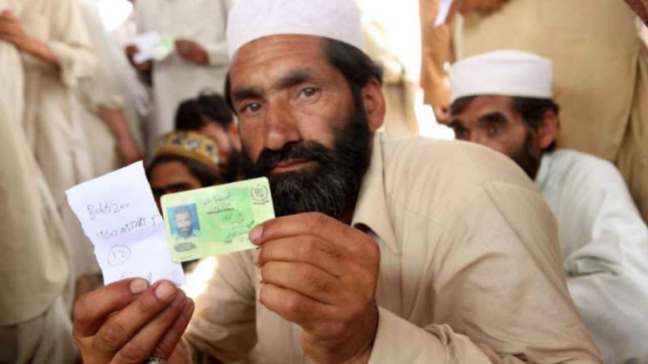 Pakistani citizen waiting outside NADRA office