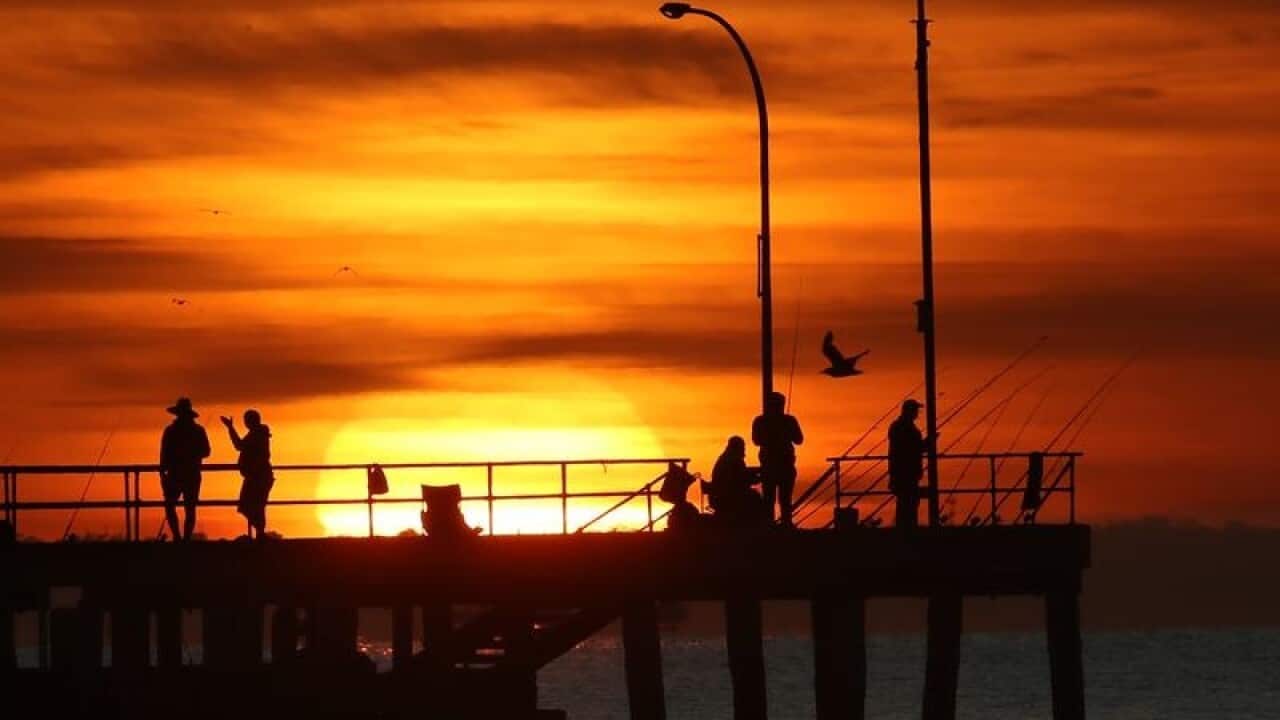 Sunrise over Altona pier in Melbourne.