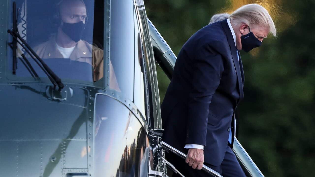 US President Donald Trump exits Marine One while arriving to Walter Reed National Military Medical Center in Bethesda, Maryland, USA, on 2 October 2020.