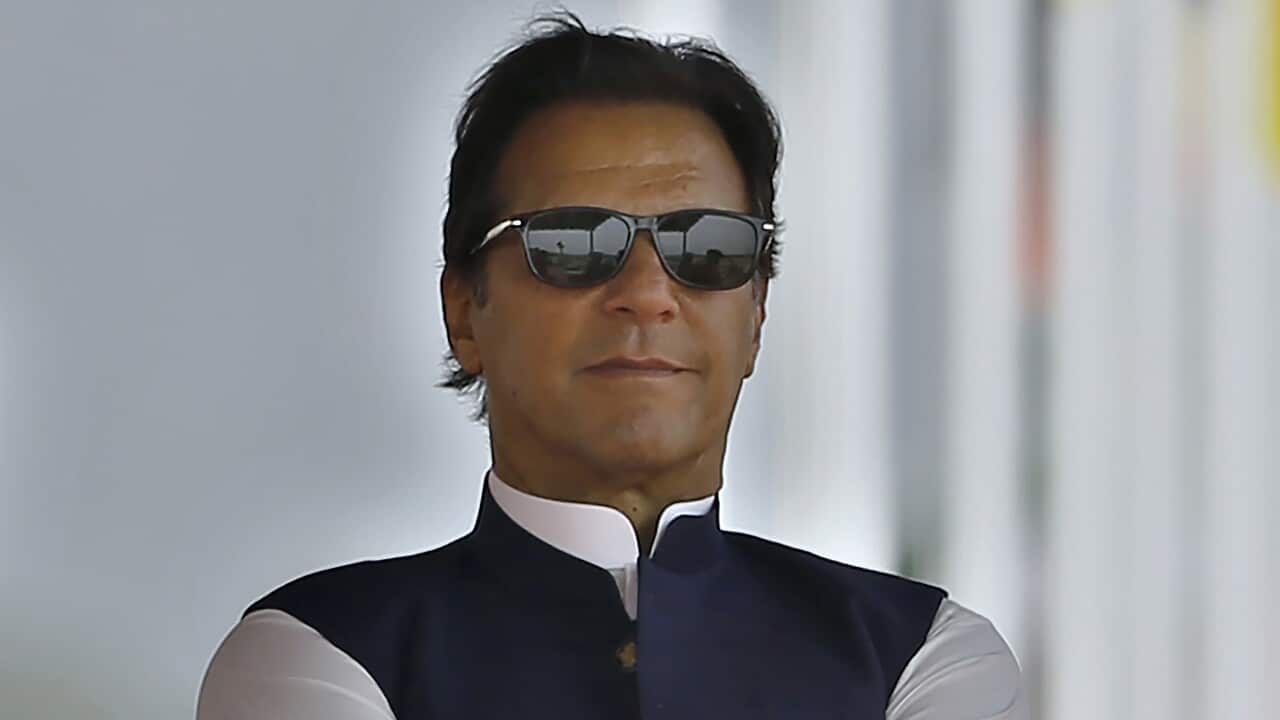 Pakistan's Prime Minister Imran Khan attends a military parade to mark Pakistan National Day, in Islamabad, Pakistan, Wednesday, March 23, 2022.