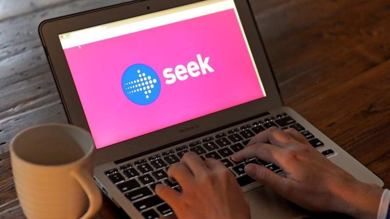 The logo of job seeking website 'Seek' is seen on laptop a screen.