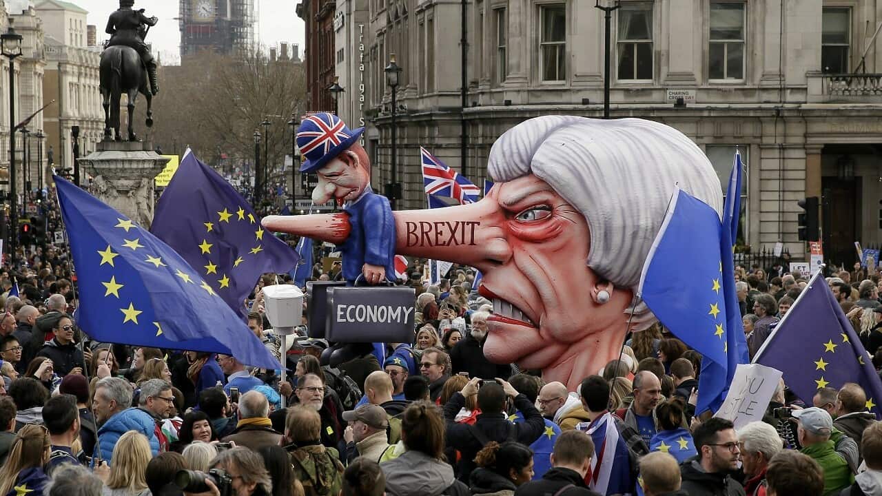 An effigy of British PM Theresa May is wheeled through Trafalgar Square during a Peoples Vote anti-Brexit march in London, Saturday, March 23, 2019. 