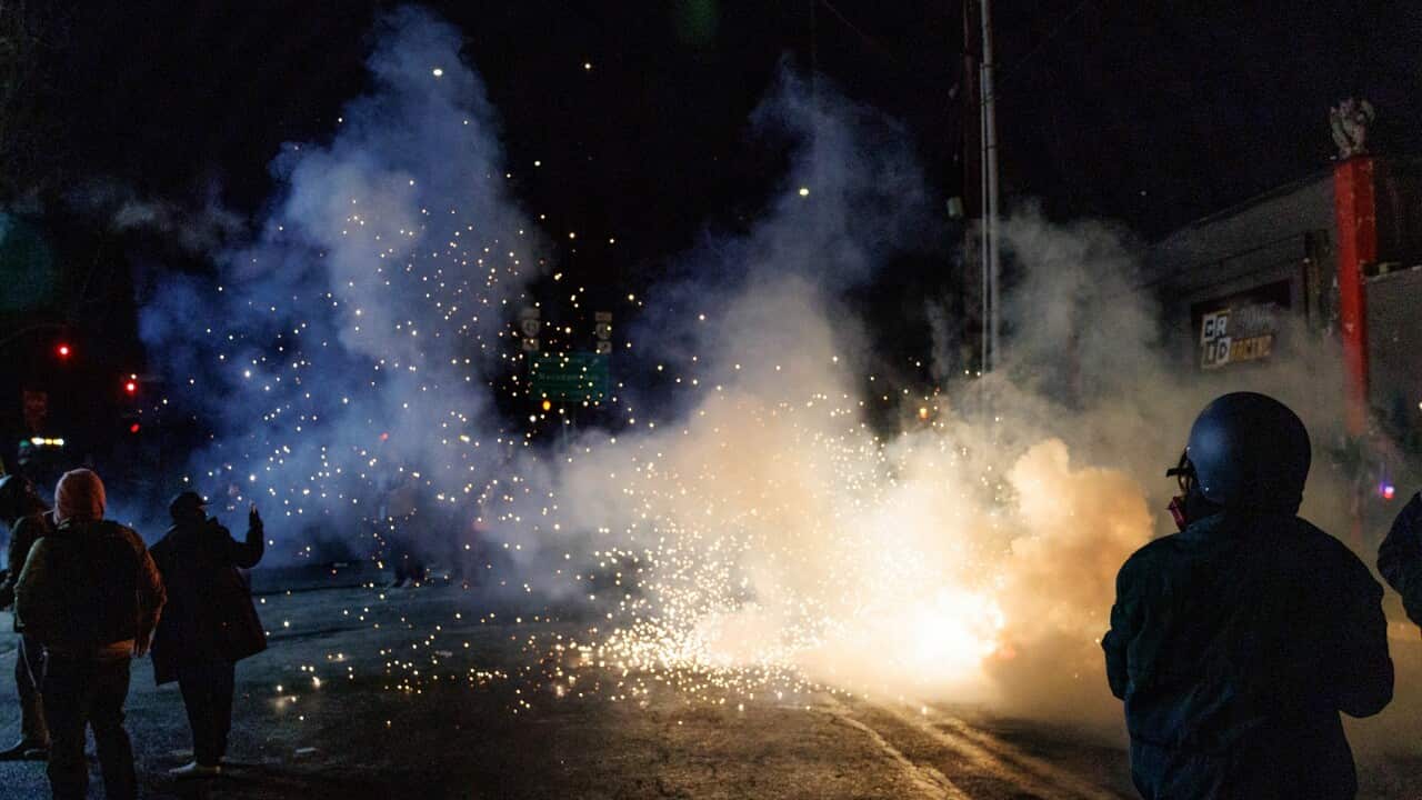 ICE agents unleash tear gas and flash bang grenades during protests over the killing of Alex Pretti (AAP)