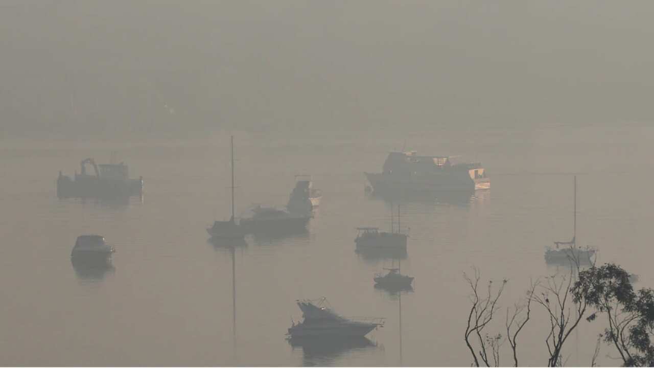 A smoke haze is seen blanketing the Parramatta River, near Rhodes, in Sydney, Tuesday, 19 November, 2019. Source: AAP