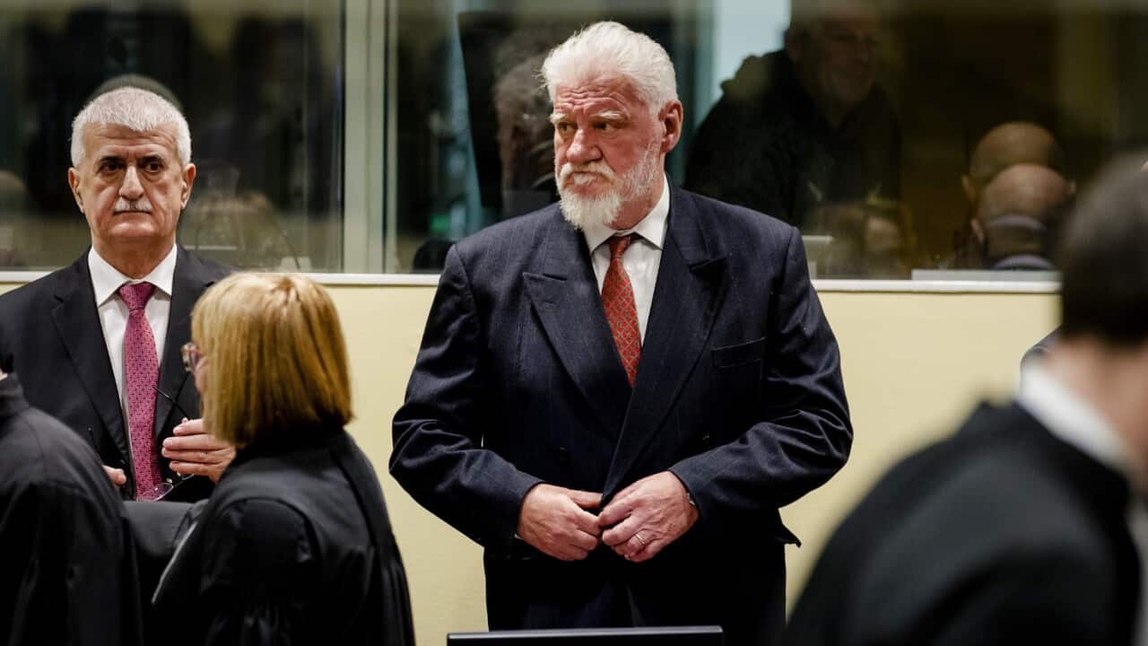 Croatian former general Slobodan Praljak (C) arrives at the International Criminal Tribunal for the former Yugoslavia (ICTY),
