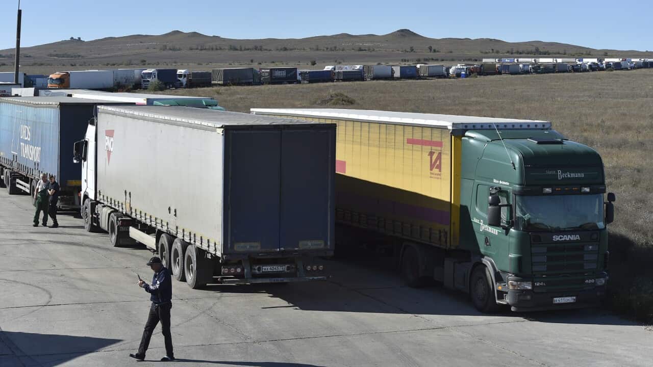 Trucks queueing for the ferry connecting Crimean peninsula and Russia at the Kerch Strait