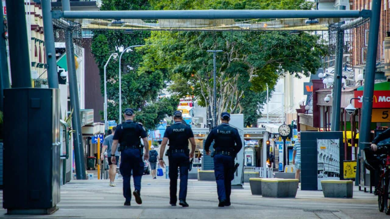 Police officers patrol the Valley Mall in Brisbane on 29 March as more than two million people in the city entered a three-day lockdown.