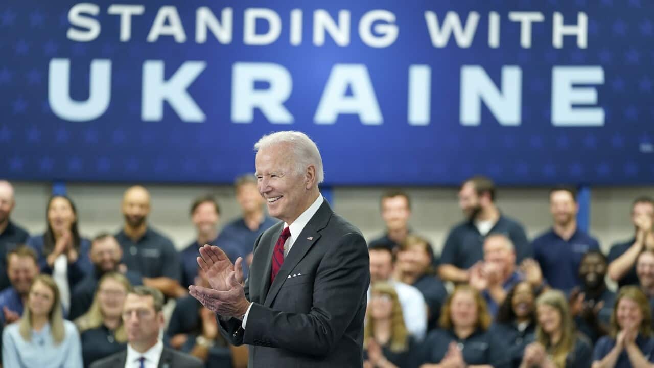 President Joe Biden smiles before speaking on security assistance to Ukraine
