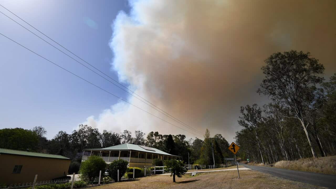 Smoke from an out-of-control bushfire in Queensland