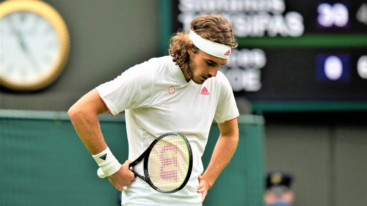 Stefanos Tsitsipas loses to Frances Tiafoe of the US during the men's singles match on day one of the Wimbledon Tennis Championships in London, June 28, 2021.
